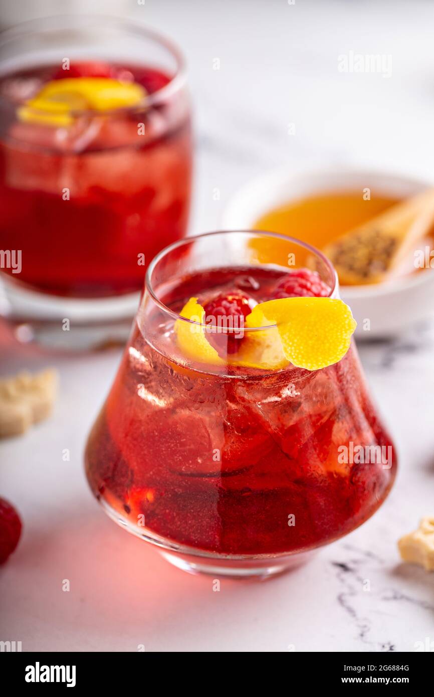 Raspberry, honey and lemon cocktail or mocktail Stock Photo