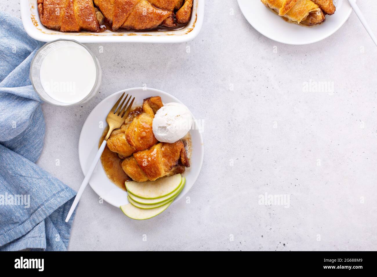 Apple dumplings in flaky pastry with caramel sauce Stock Photo