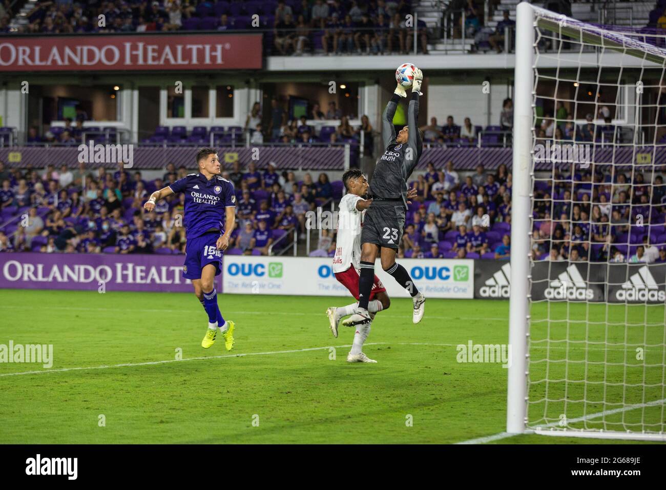 Exploria Stadium Orlando, FL, USA. 8th July, 2021. Orlando City SC goalkeeper Brandon Austin (23) jumps to grab the ball out of midair during MLS action between the NY Red Bulls and the Orlando City SC at Exploria Stadium Orlando, FL. New York defeats Orlando 2 - 1. Jonathan Huff/CSM/Alamy Live News Stock Photo