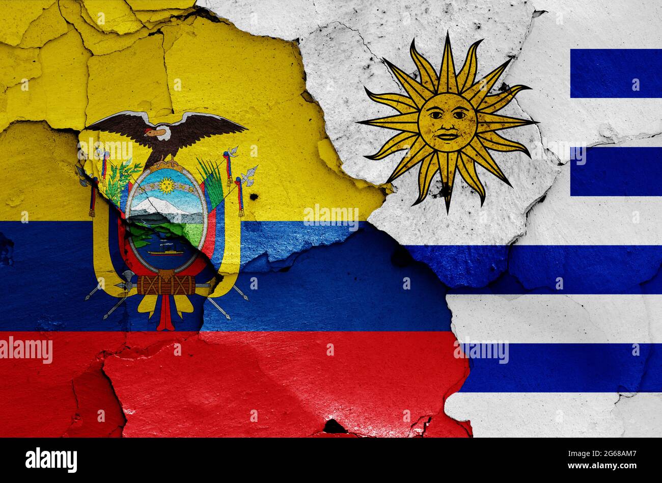 flags of Ecuador and Uruguay painted on cracked wall Stock Photo