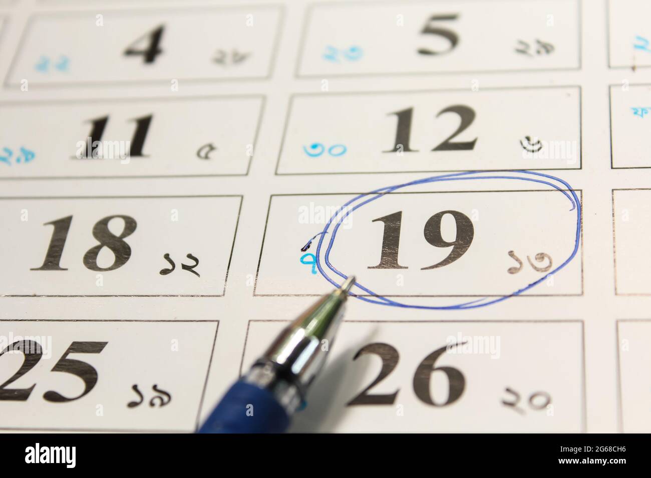 Blue circle, mark on the calendar at 19 Stock Photo