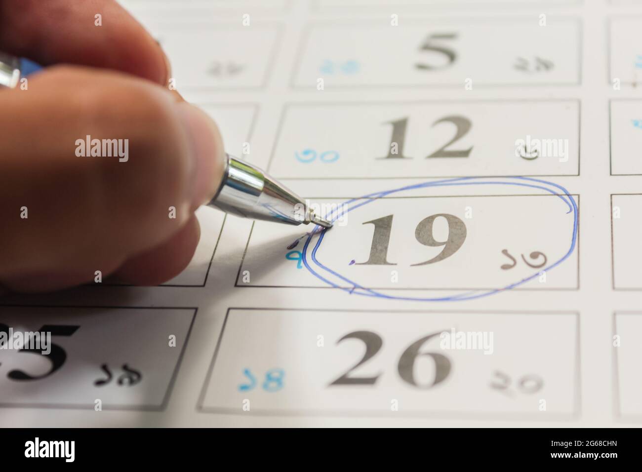 Blue circle, mark on the calendar at 19 Stock Photo