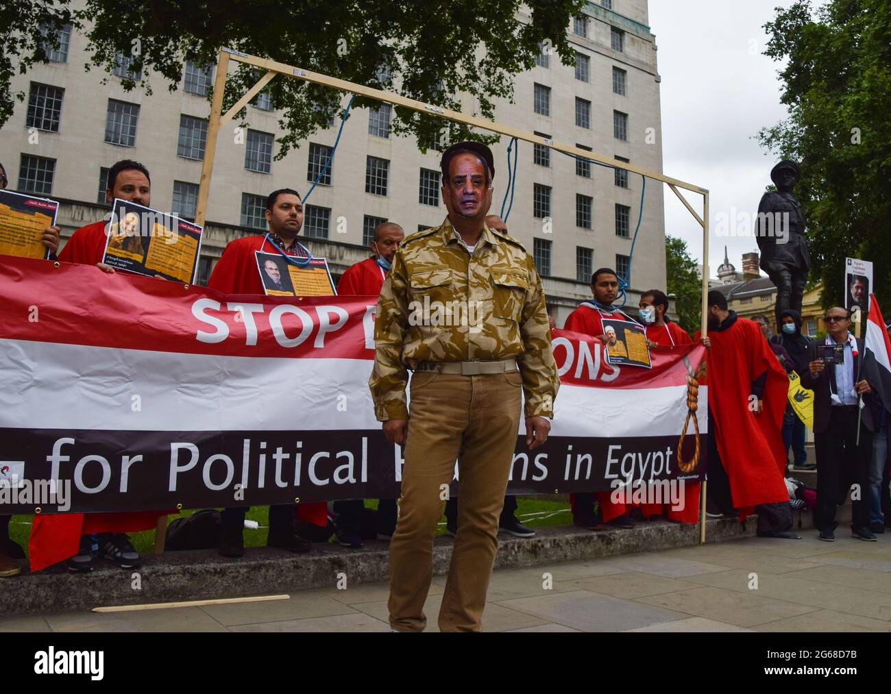 London, UK. 03rd July, 2021. A protester wears a mask of the current president of Egypt, Abdel Fattah El-Sisi during the demonstrationProtesters gathered outside Downing Street on the anniversary of the 2013 coup in Egypt. Credit: SOPA Images Limited/Alamy Live News Stock Photo