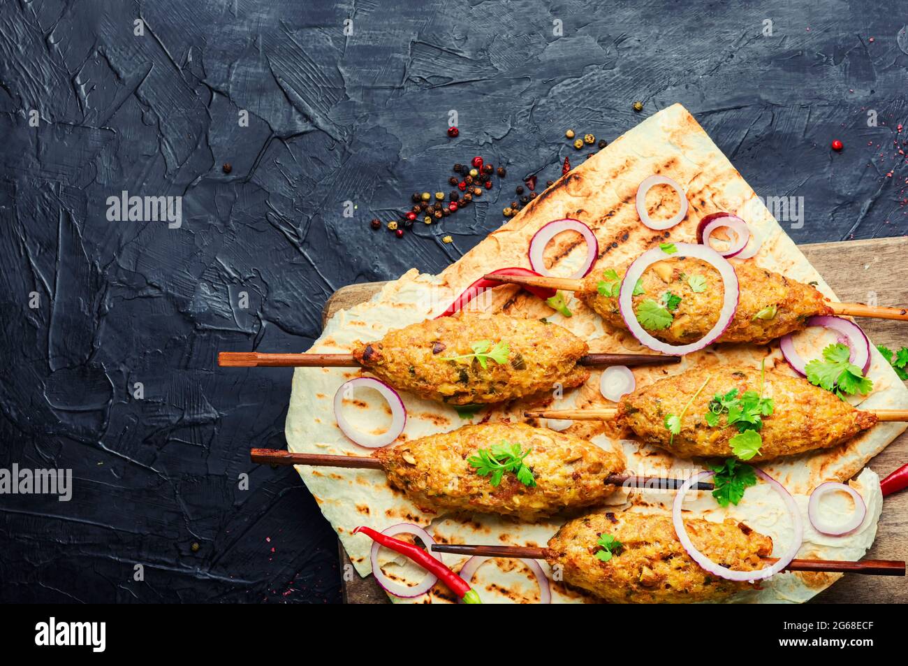 Traditional lula kebab on a wooden skewer. Lamb dish. Eastern cuisine Stock Photo Alamy