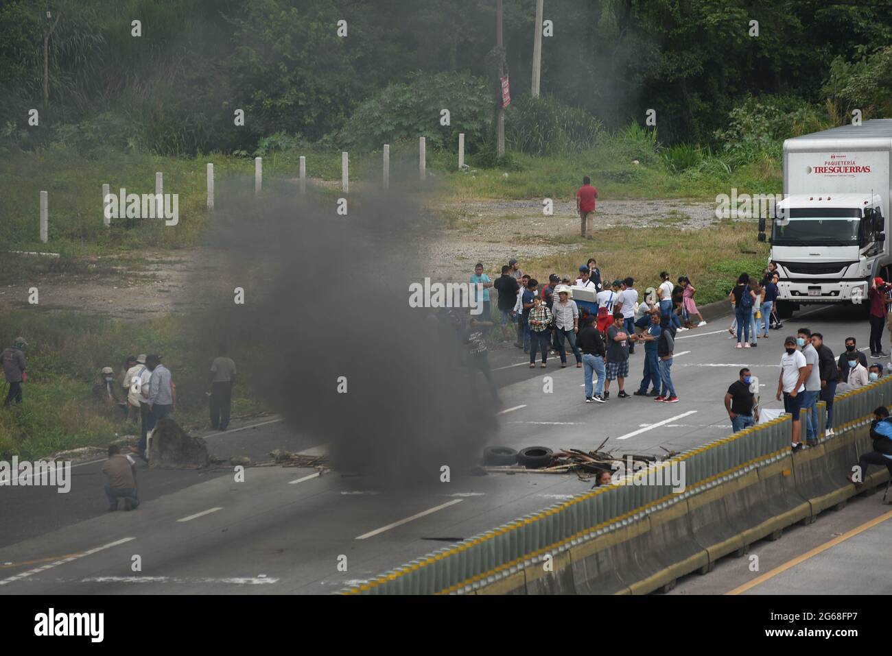 July 3, 2021: Relatives of Jonathan Herrera and Eduardo Aguilar, adolescents of 14 and 15 years of age, assassinated by the Civil Force, carry out blockades and protests on the Veracruz-Mexico highway, to demand justice Credit: Hector Adolfo Quintanar Perez/ZUMA Wire/Alamy Live News Stock Photo