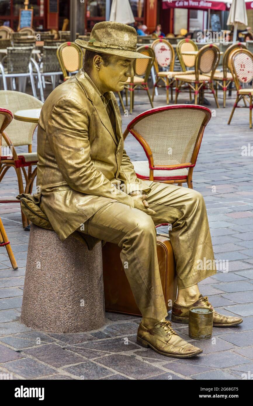 Well-known 'Golden Man' posing as statue for tourists in centre of Tours, Indre-et-Loire, France. Stock Photo