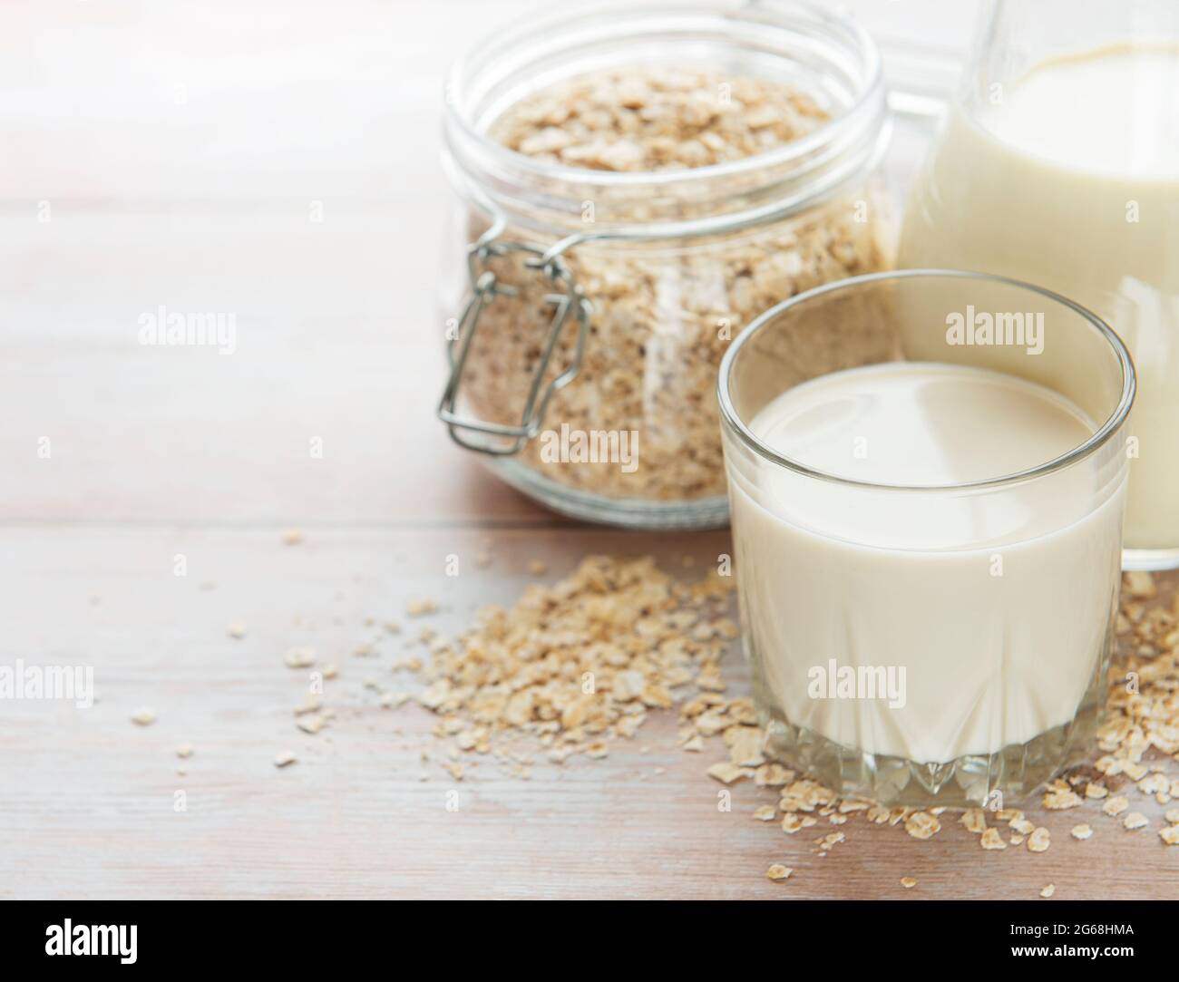 Vegan non dairy alternative milk. Oat flakes milk Stock Photo Alamy