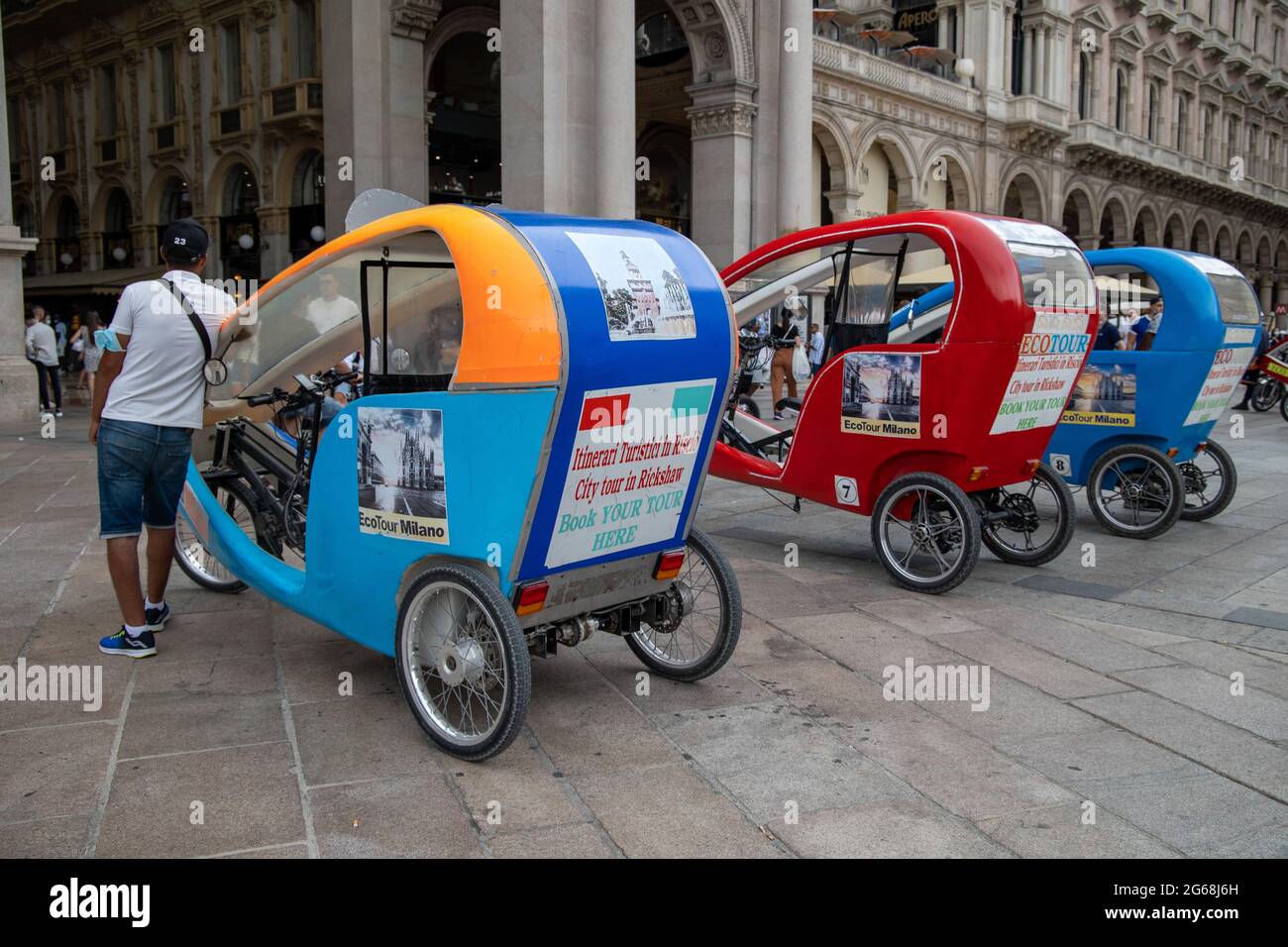 Milan, Italy july 3 2021 - rickshaw at Duomo Square eco tour for tourists Stock Photo