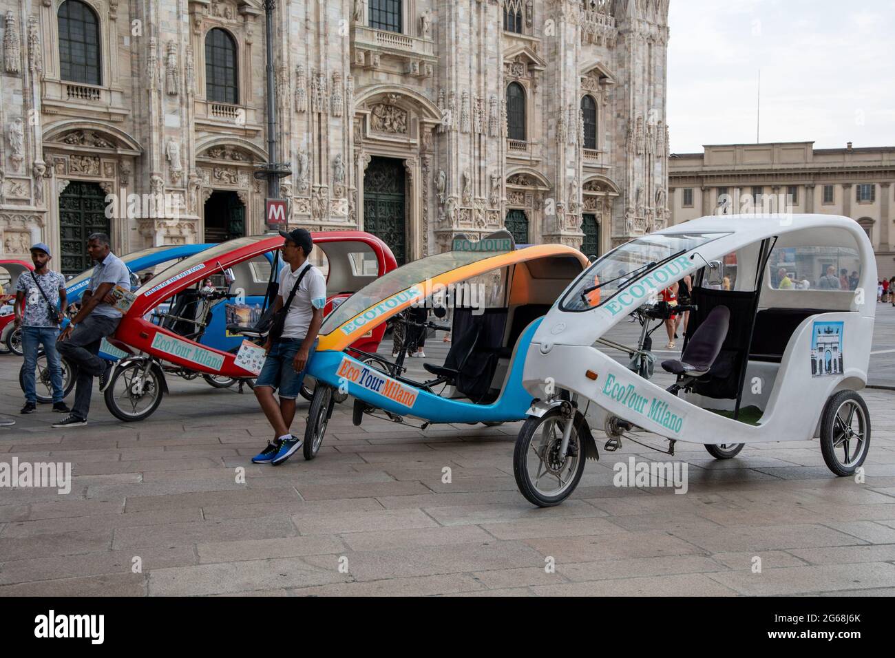 Milan, Italy july 3 2021 - rickshaw at Duomo Square eco tour for tourists Stock Photo