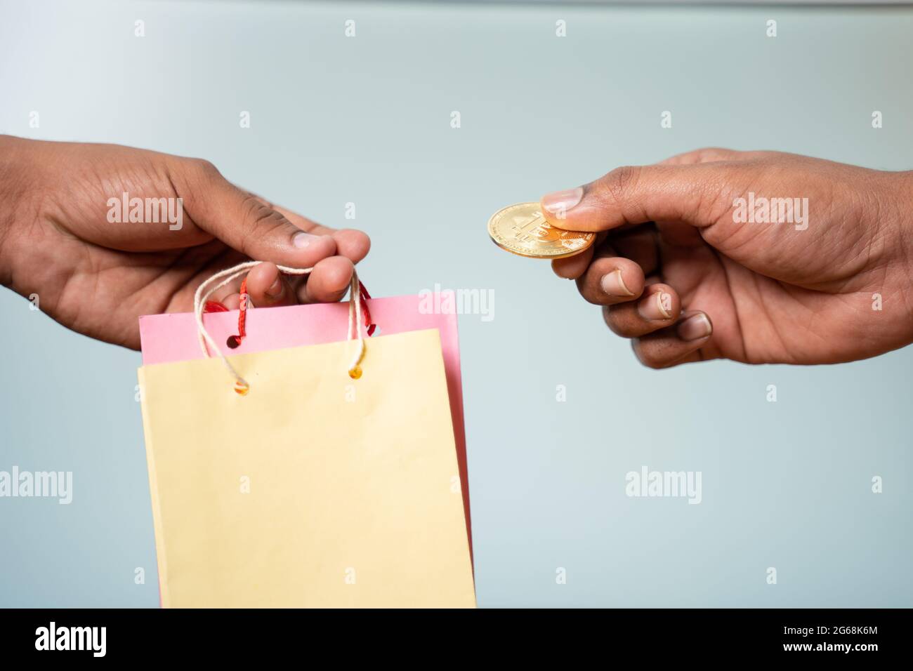 Concept showing of bitcoin or cryptocurrency payment for purchasing or shopping by using bags. Stock Photo
