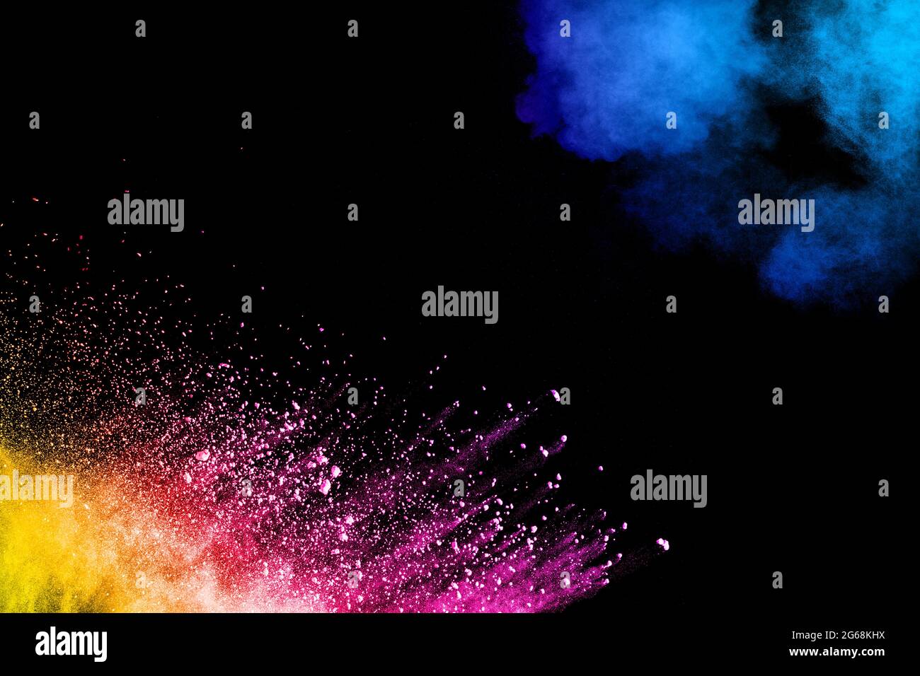 Abstract colorful powder explosion on black background.Freeze motion of dust splash.Painted Holi. Stock Photo