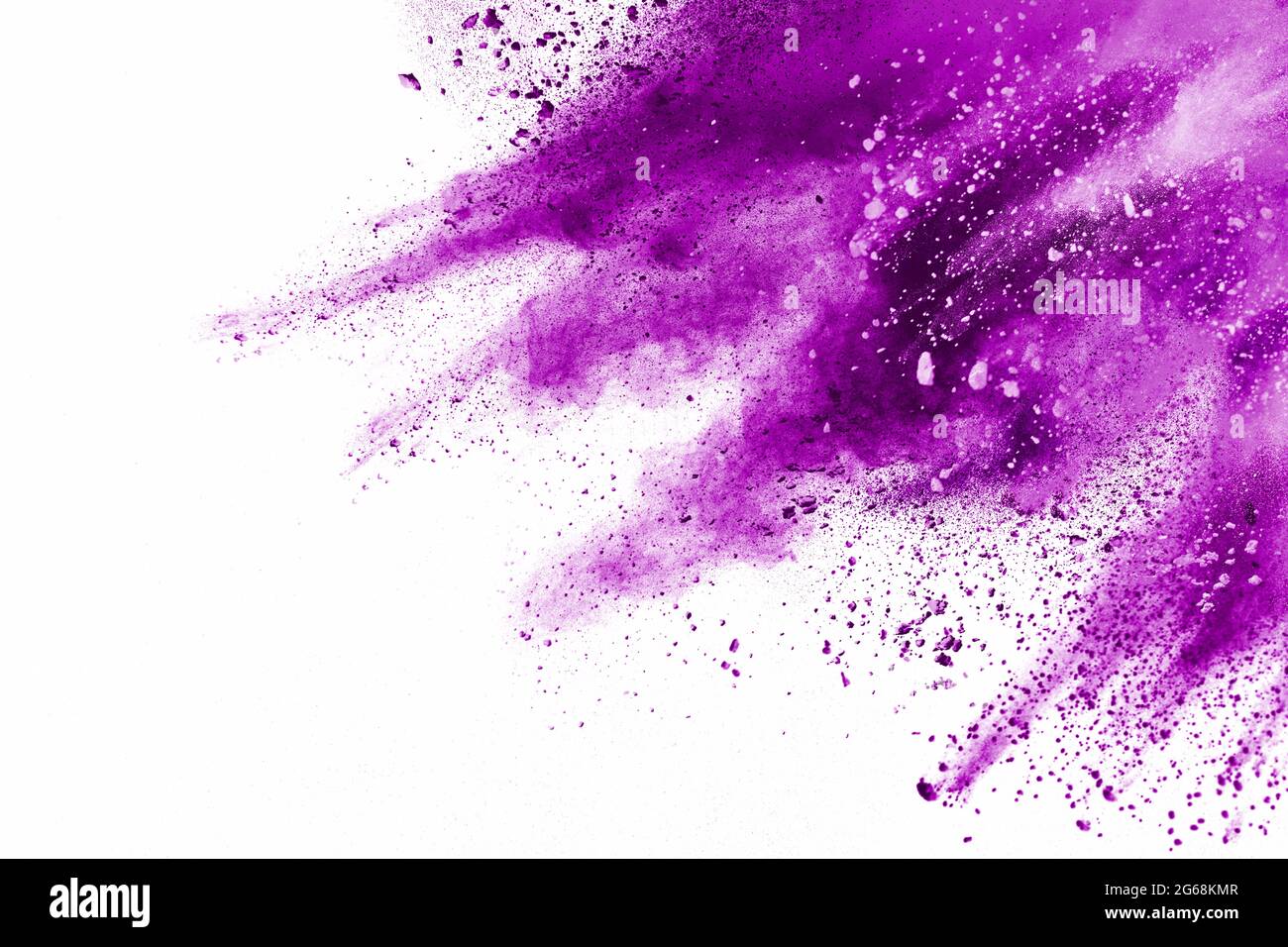 Purple particle explosion on white background.Freeze motion of purple dust splash on background. Stock Photo