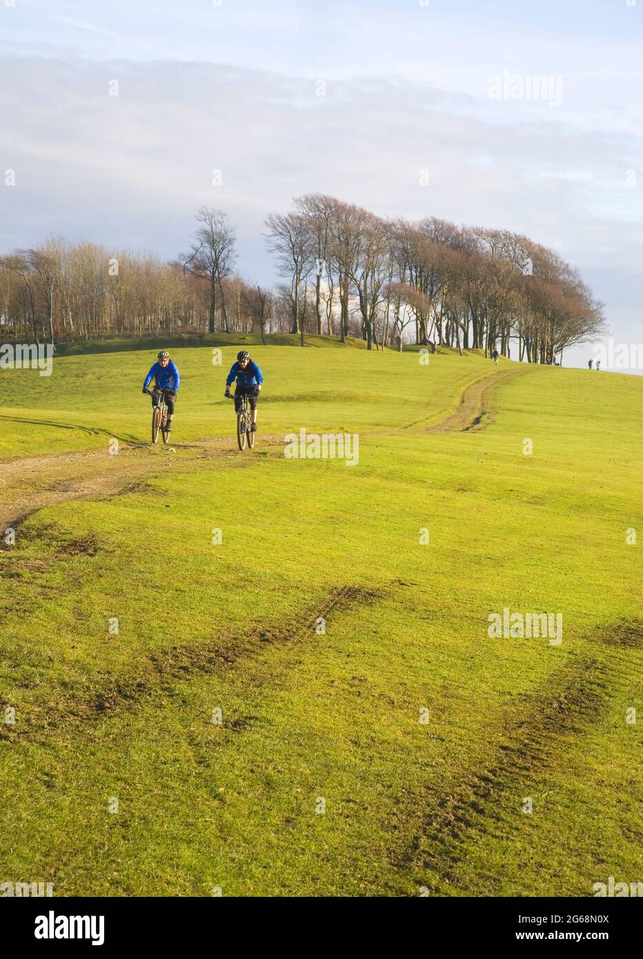 walkers and cyclists at chanctonbury ring on the south downs way in west sussex Stock Photo