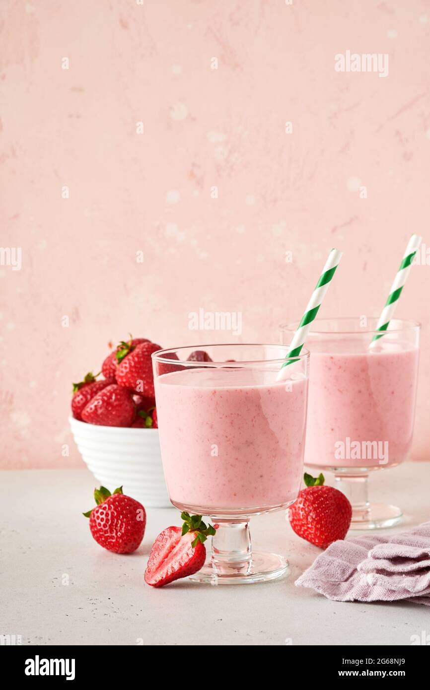 pink smoothie with wild cranberries in mason jar with mint and straw on  wooden background Stock Photo by nblxer