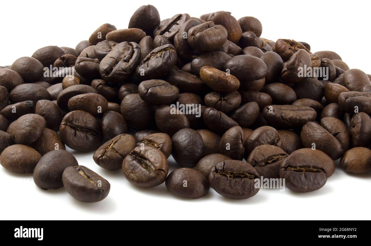 A bunch of coffee beans. Fried arabica isolated on white background ...