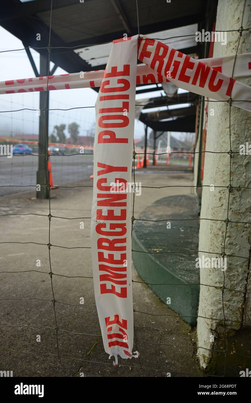 police emergency tape prevents public access at a suspected crime scene still under investigation Stock Photo