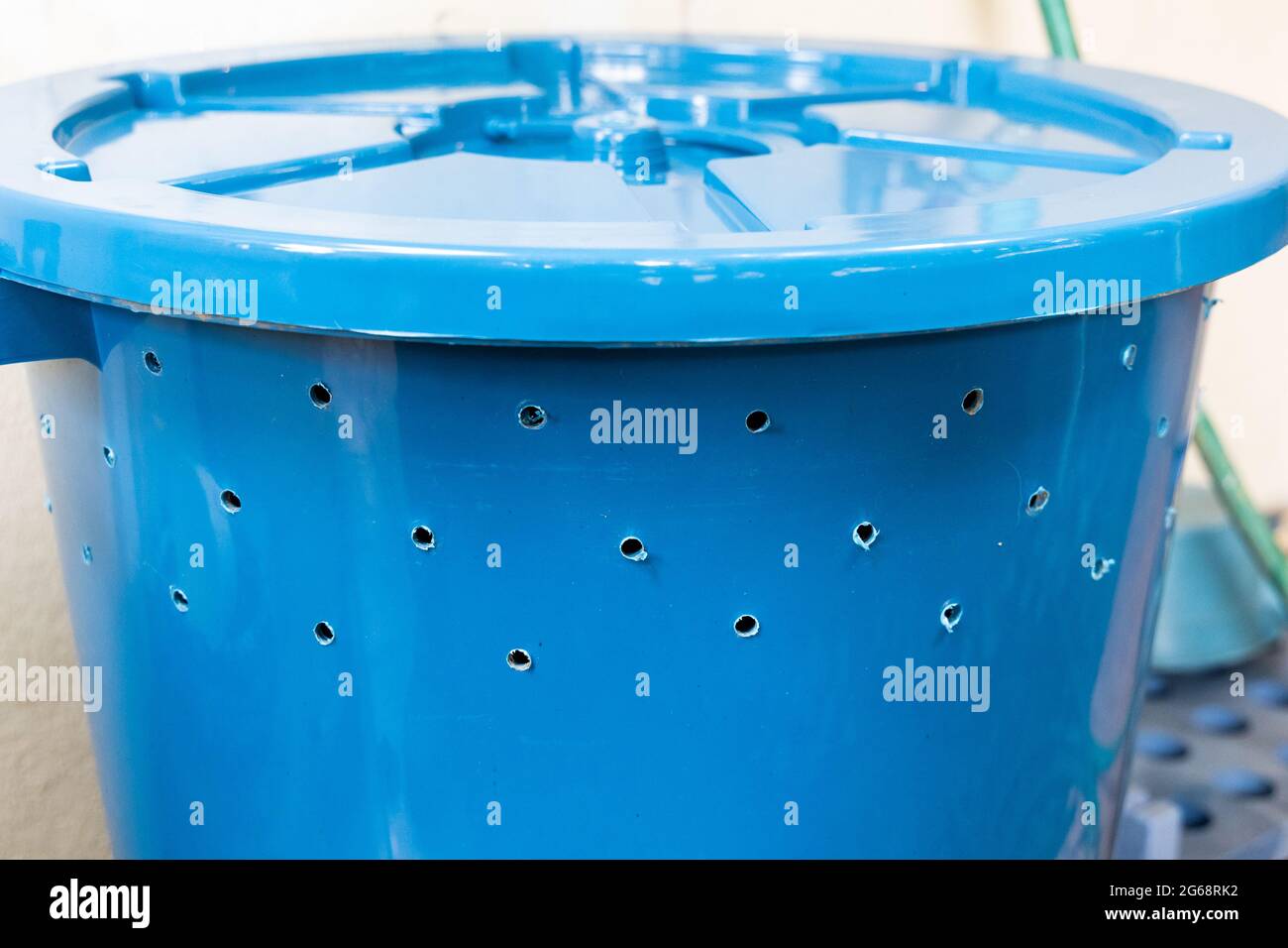 Bin with multiple holes drilled to be used to produce organic compost