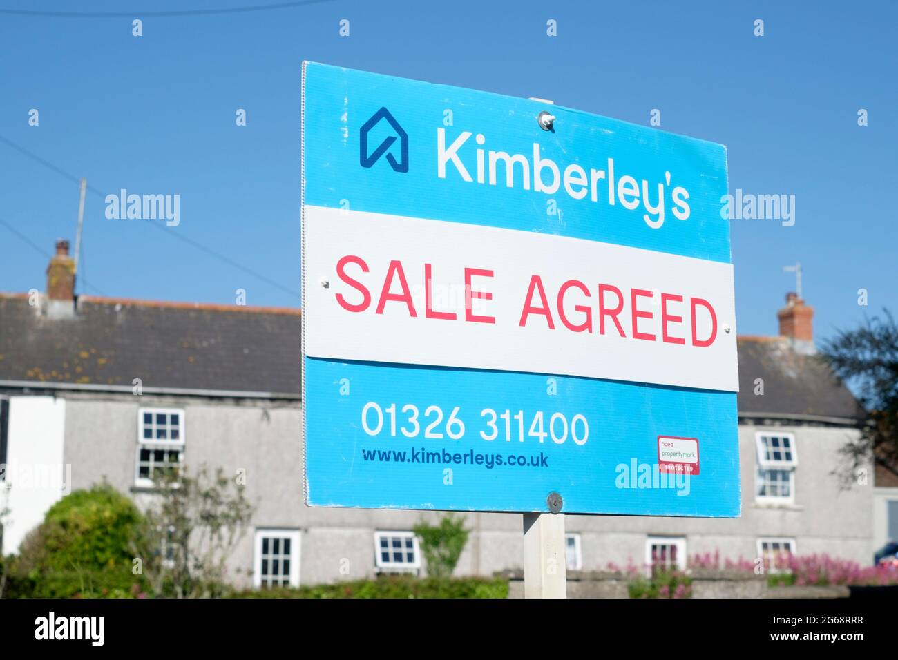Estate Agent for sale sign in a Cornish village, Cornwall UK Stock Photo