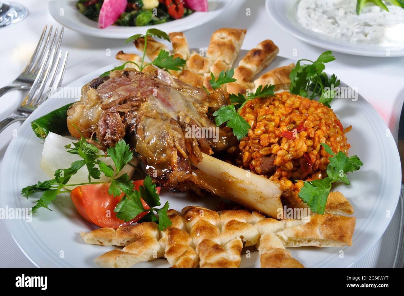 A magnificent dining table and traditional tandir kebab in a luxury restaurant, Turkish traditional doner kebab Stock Photo