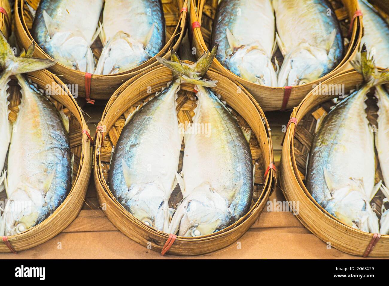 Mackerel Fishes in the Basket market business fishing industry for food. Stock Photo