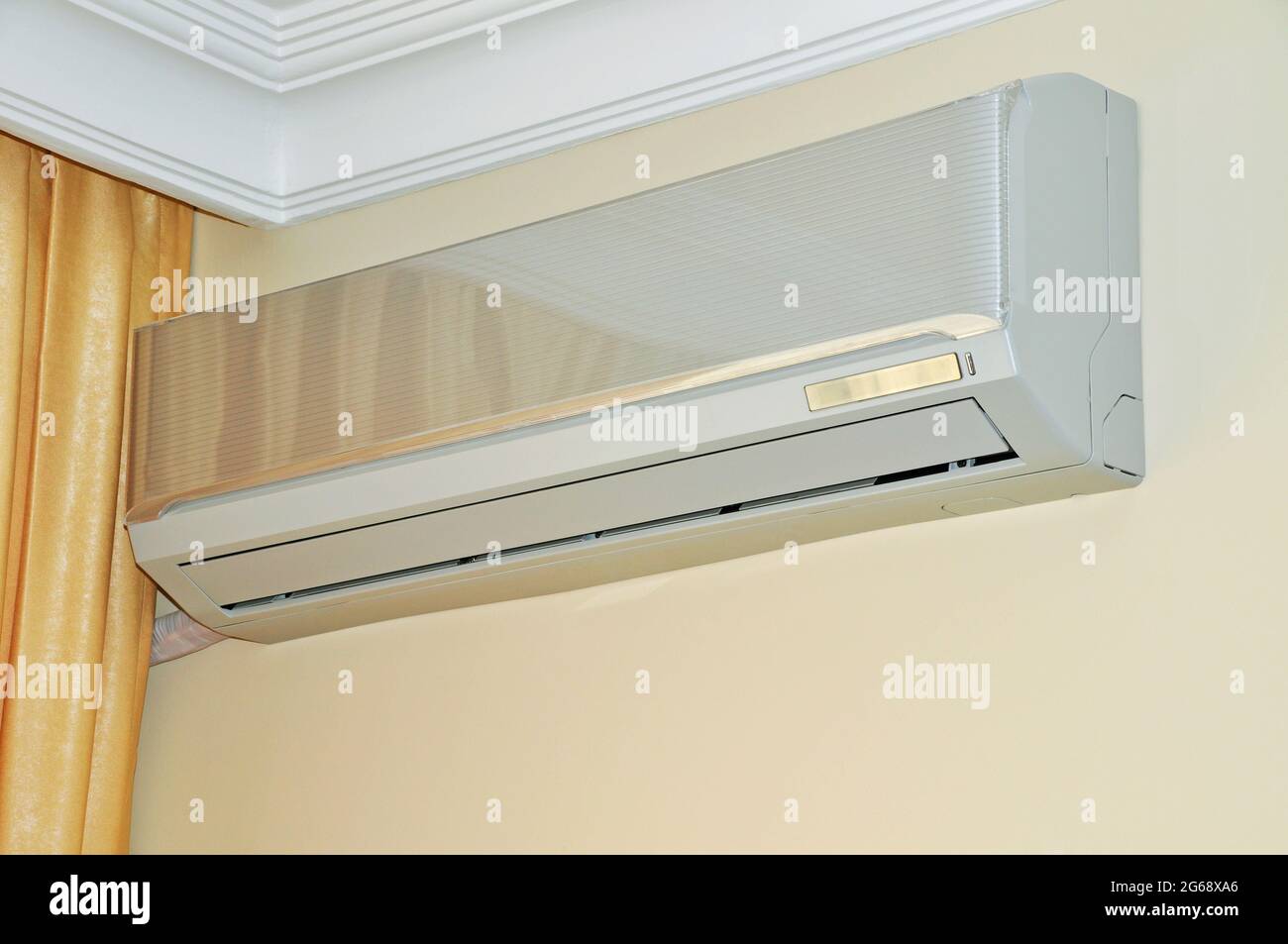 Air conditioner indoor unit mounted on home wall, used in summer and