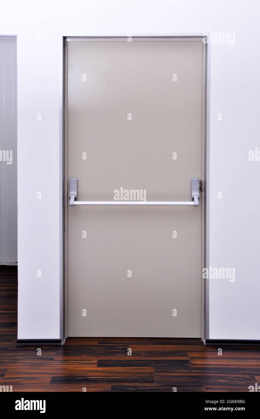 Emergency exit door. Closed up latch and orange door handle of