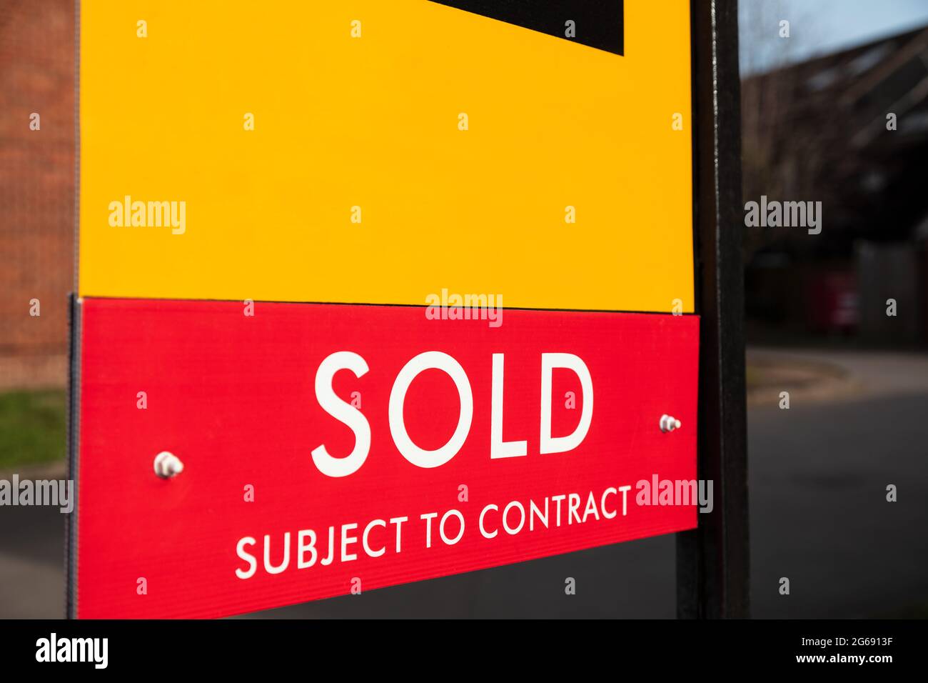 Close up Sold Subject to Contract Real Estate Agent Sign or Board Stock Photo