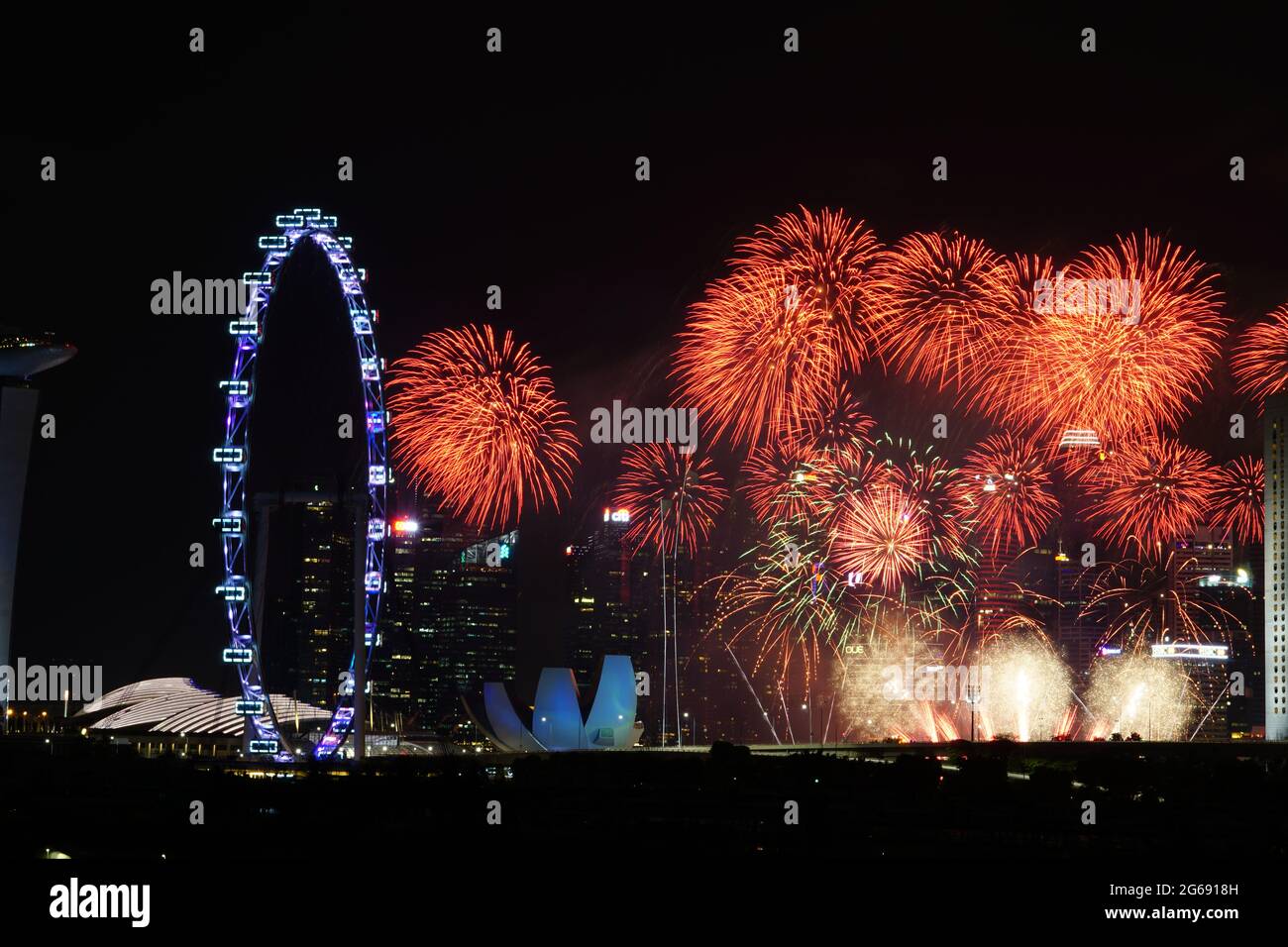 Sparkling firework around Singapore Flyer Stock Photo