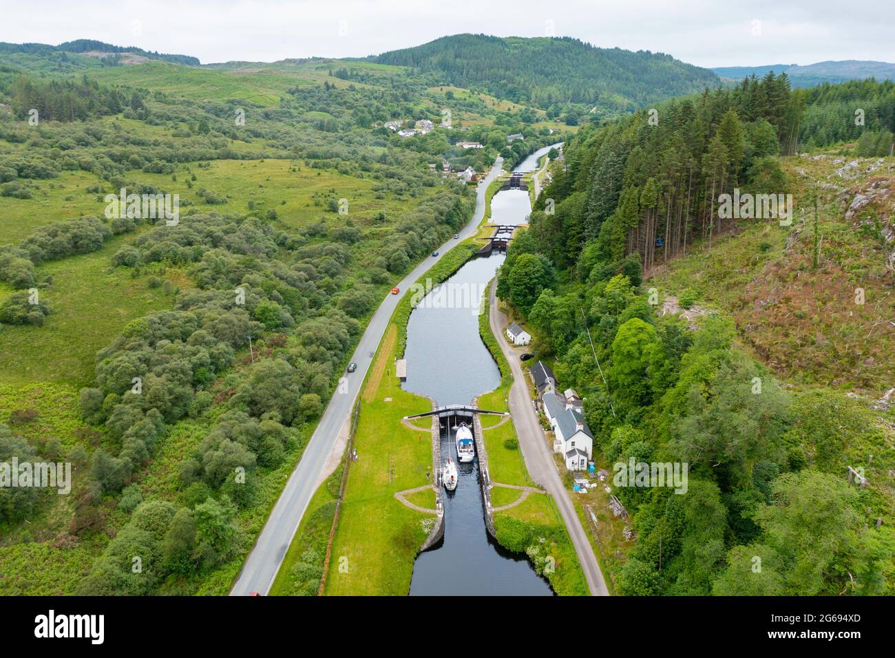 Aerial view from drone of Crinan Canal at village of Cairnbaan in Argyll & Bute, Scotland, UK Stock Photo