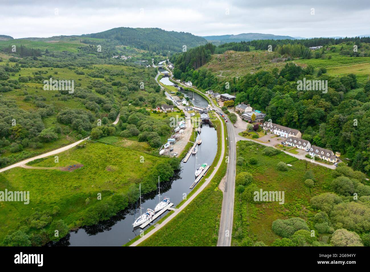 Aerial view from drone of Crinan Canal at village of Cairnbaan in Argyll & Bute, Scotland, UK Stock Photo