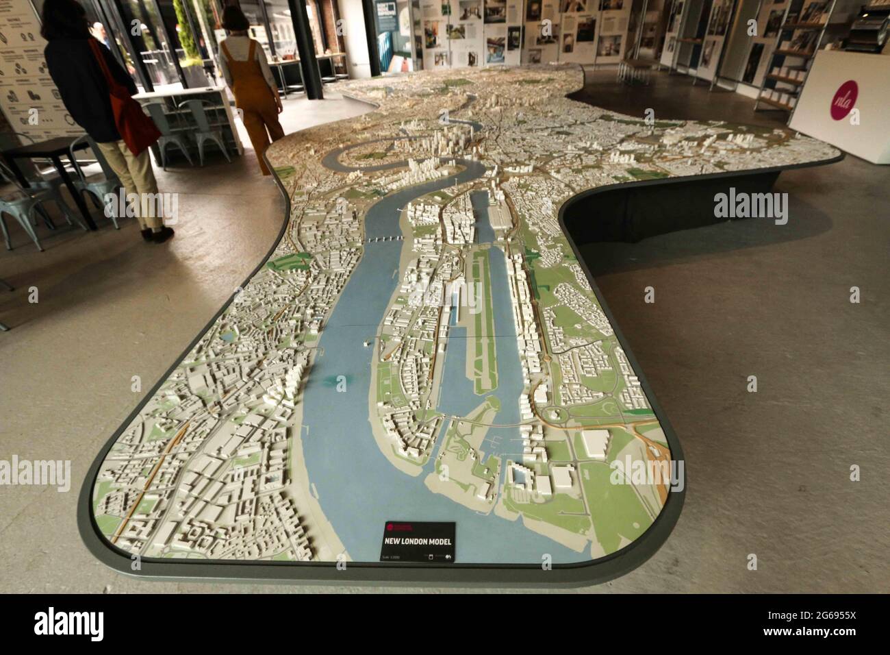 London, UK. 04th July, 2021. A large scale model showing off most of central London. including Wembley stadium.It's as much a thing to look at and point at for the public, as a sales and explanatory tool for architects and urban planners.The exhibition space is open Mon-Fri 8am-6pm and Sat-Sun 10am-6pm. It can be found on the upper floor of the Coal Drops Yard Credit: Paul Quezada-Neiman/Alamy Live News Stock Photo