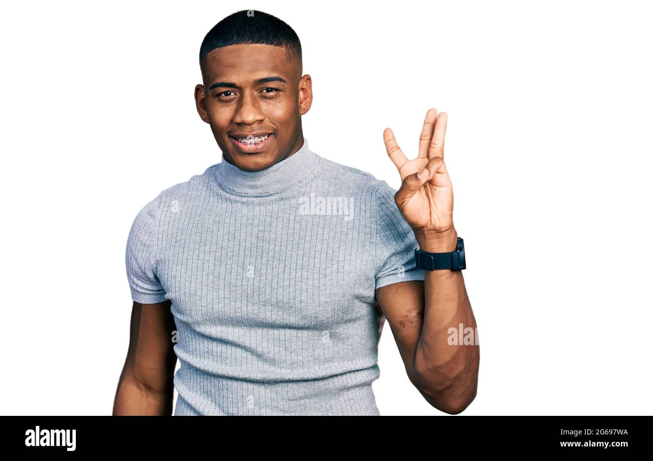 Young black man wearing casual t shirt showing and pointing up with ...