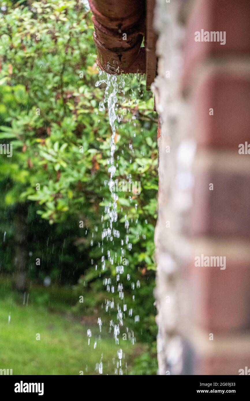 Heavy rain overflowing gutters Stock Photo Alamy