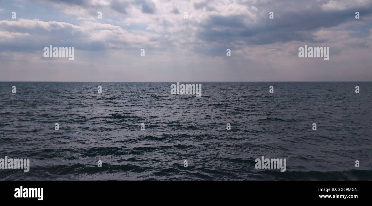 stormy background: dark sea and dramatic clouds Stock Photo - Alamy