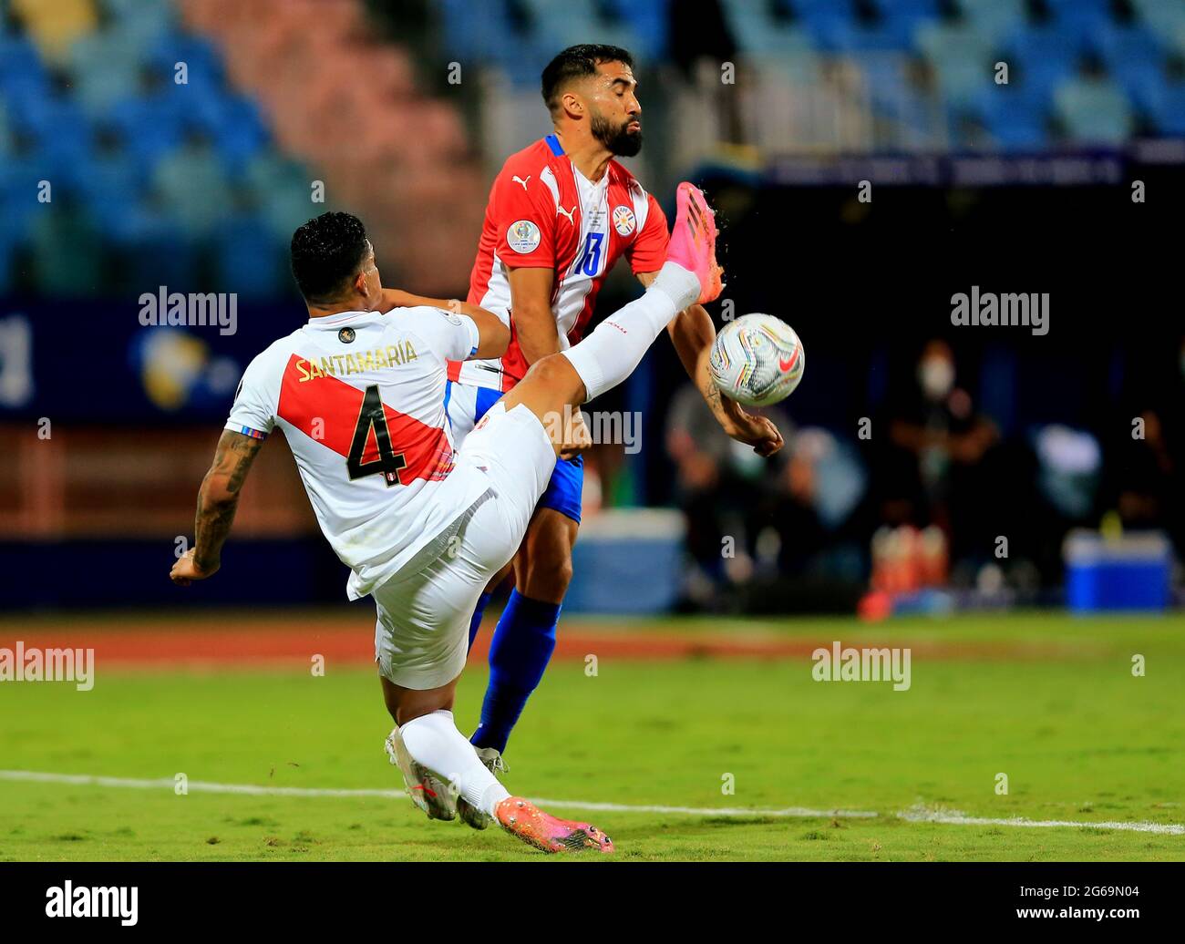 GOIANIA, BRAZIL - JULY 02: Alberto Espinola of Paraguay competes for the ball with Anderson Santamaria of Peru ,during the Quarterfinal match between Peru and Paraguay as part of Conmebol Copa America Brazil 2021 at Estadio Olimpico on July 2, 2021 in Goiania, Brazil. (MB Media) Stock Photo