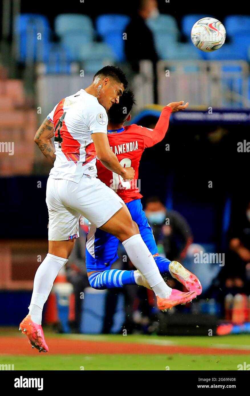 GOIANIA, BRAZIL - JULY 02: Anderson Santamaria of Peru head the ball against Santiago Arzamendia of Paraguay ,during the Quarterfinal match between Peru and Paraguay as part of Conmebol Copa America Brazil 2021 at Estadio Olimpico on July 2, 2021 in Goiania, Brazil. (MB Media) Stock Photo