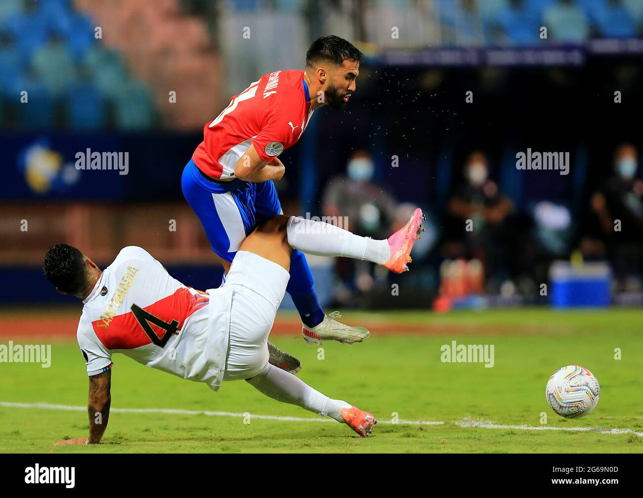 GOIANIA, BRAZIL - JULY 02: Alberto Espinola of Paraguay competes for the ball with Anderson Santamaria of Peru ,during the Quarterfinal match between Peru and Paraguay as part of Conmebol Copa America Brazil 2021 at Estadio Olimpico on July 2, 2021 in Goiania, Brazil. (MB Media) Stock Photo