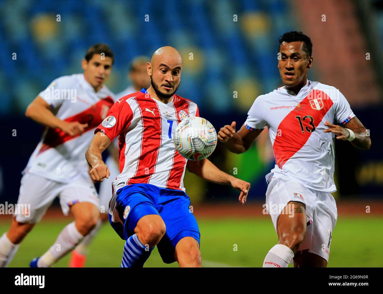 GOIANIA, BRAZIL - JULY 02: Carlos Gonzalez of Paraguay competes for the ball with Renato Tapia of Peru ,during the Quarterfinal match between Peru and Paraguay as part of Conmebol Copa America Brazil 2021 at Estadio Olimpico on July 2, 2021 in Goiania, Brazil. (MB Media) Stock Photo