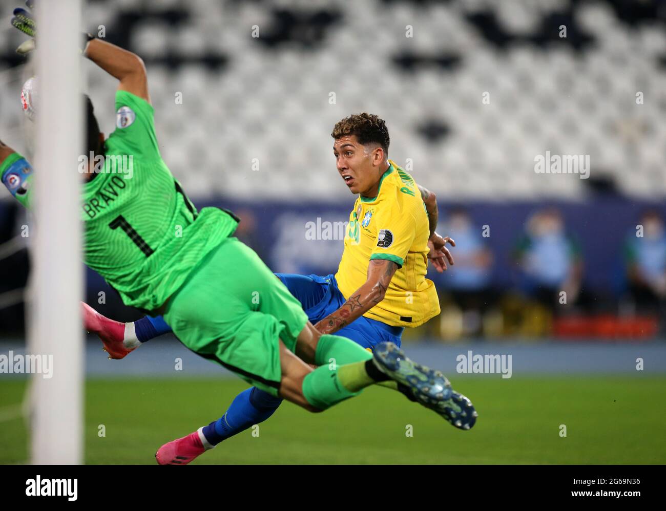 RIO DE JANEIRO, BRAZIL - JULY 02: Roberto Firmino of Brazil competes for the ball with Claudio Bravo of Chile ,during the Quarterfinal match between Brazil and Chile as part of Conmebol Copa America Brazil 2021 at Estadio Olímpico Nilton Santos on July 2, 2021 in Rio de Janeiro, Brazil. (MB Media) Stock Photo