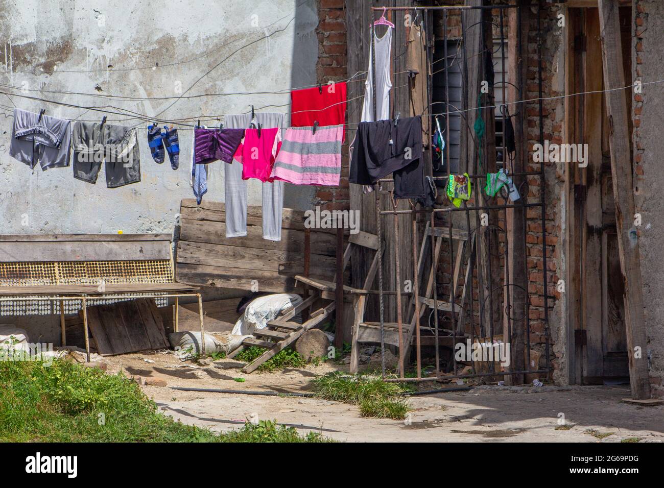 Traditional clothesline in a house in Santiago de Cuba, Cuba. The building is worn out and dilapidated. Stock Photo