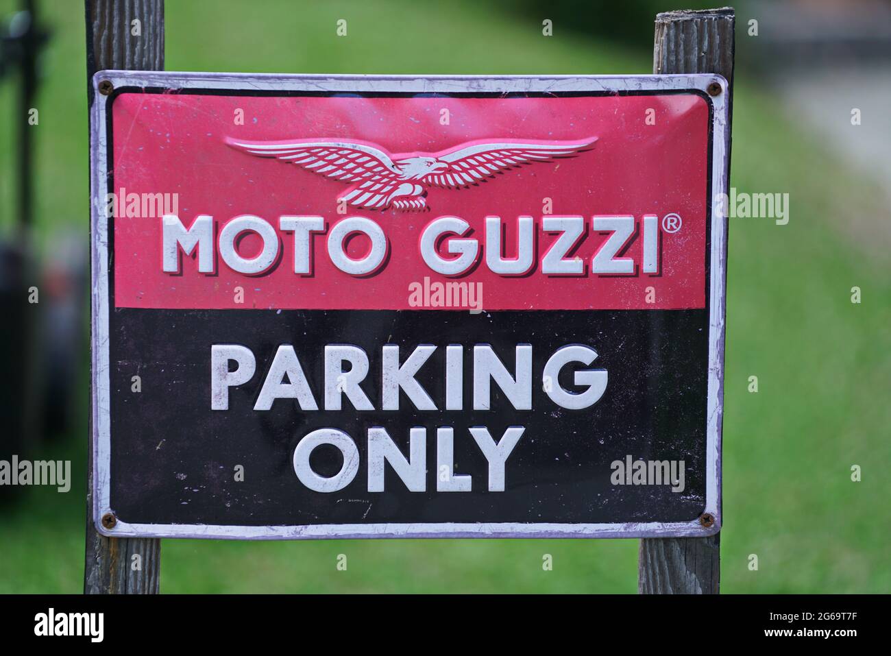Close Up of Moto Guzzi motorcycle Parking Only Sign. Milan, Italy - July 2021 Stock Photo