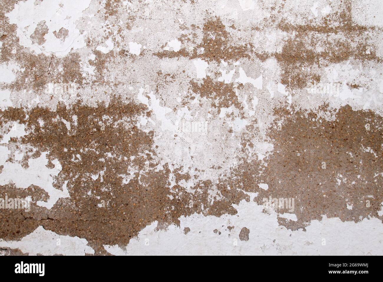 Old peeling whitewashed lime wall, grunge background or texture Stock Photo