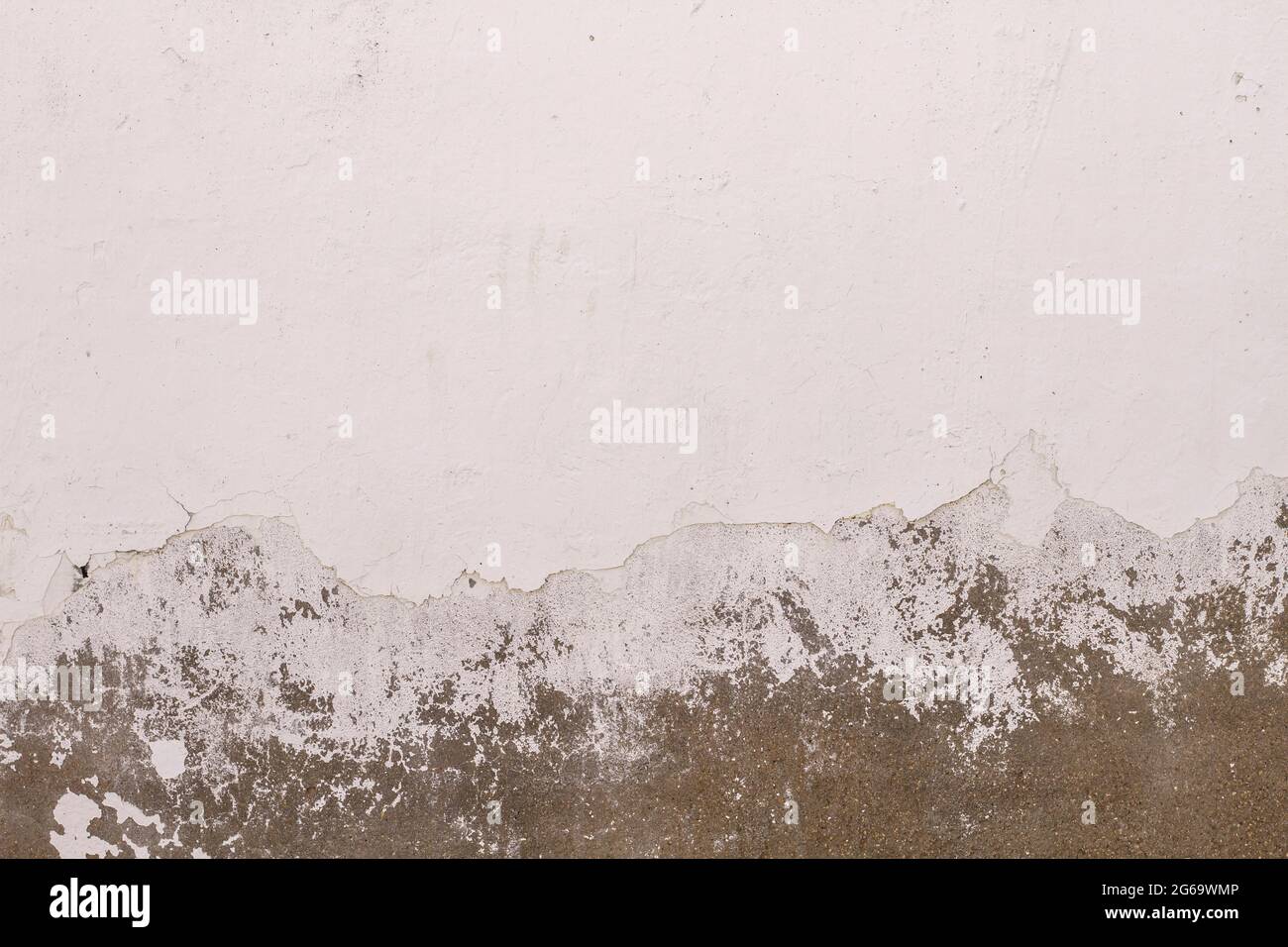 Old peeling whitewashed lime wall, white grunge background or texture Stock Photo