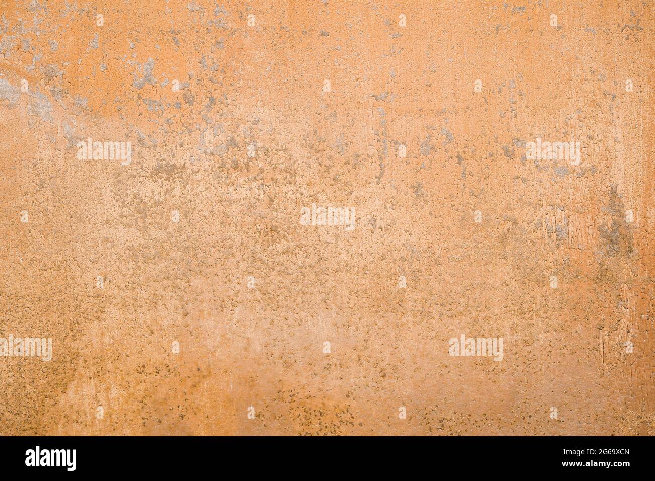 Old wall with peeling paint, peach color grunge background or texture Stock Photo
