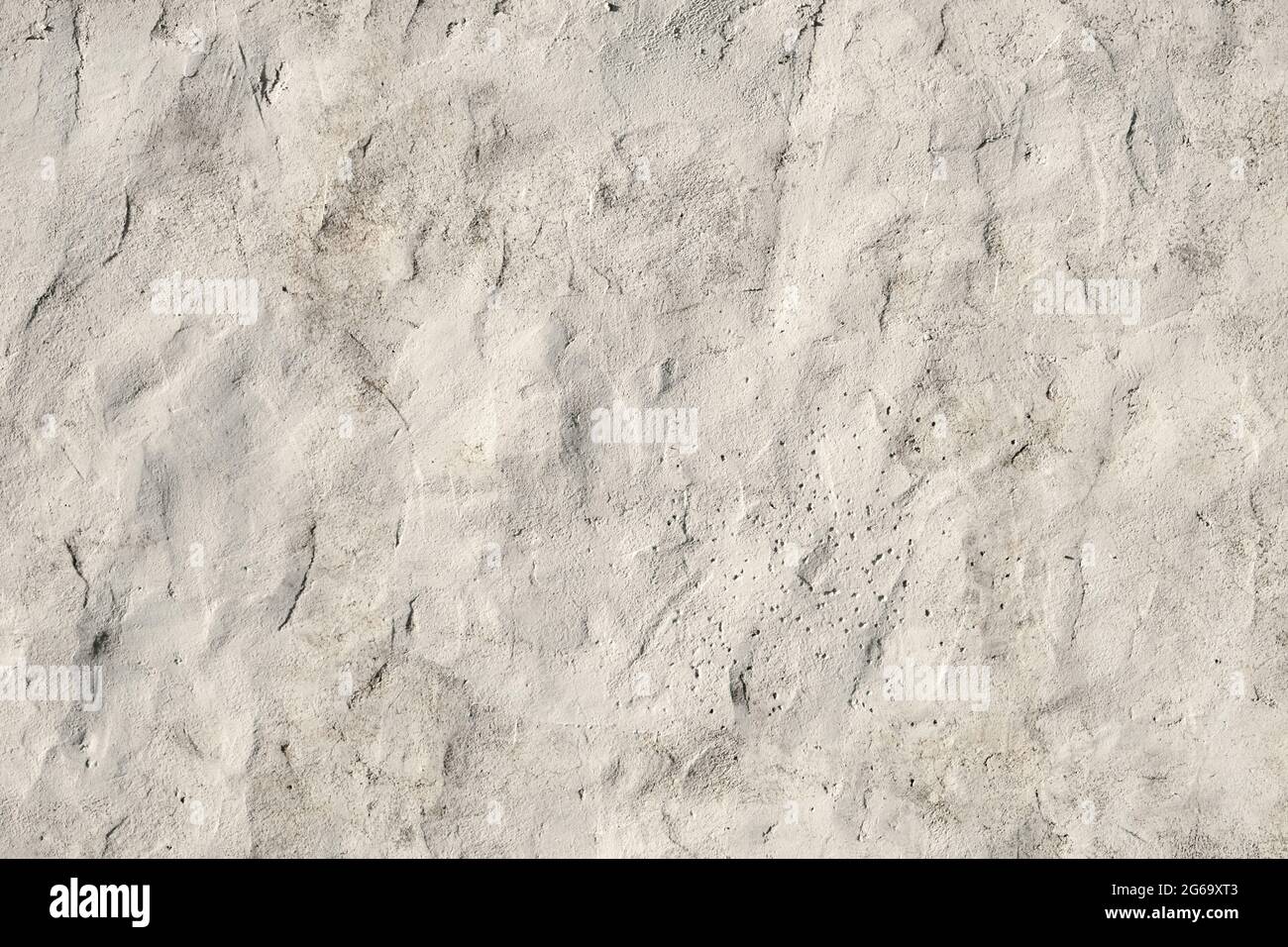 Old white painted limewashed plaster wall texture or background Stock Photo