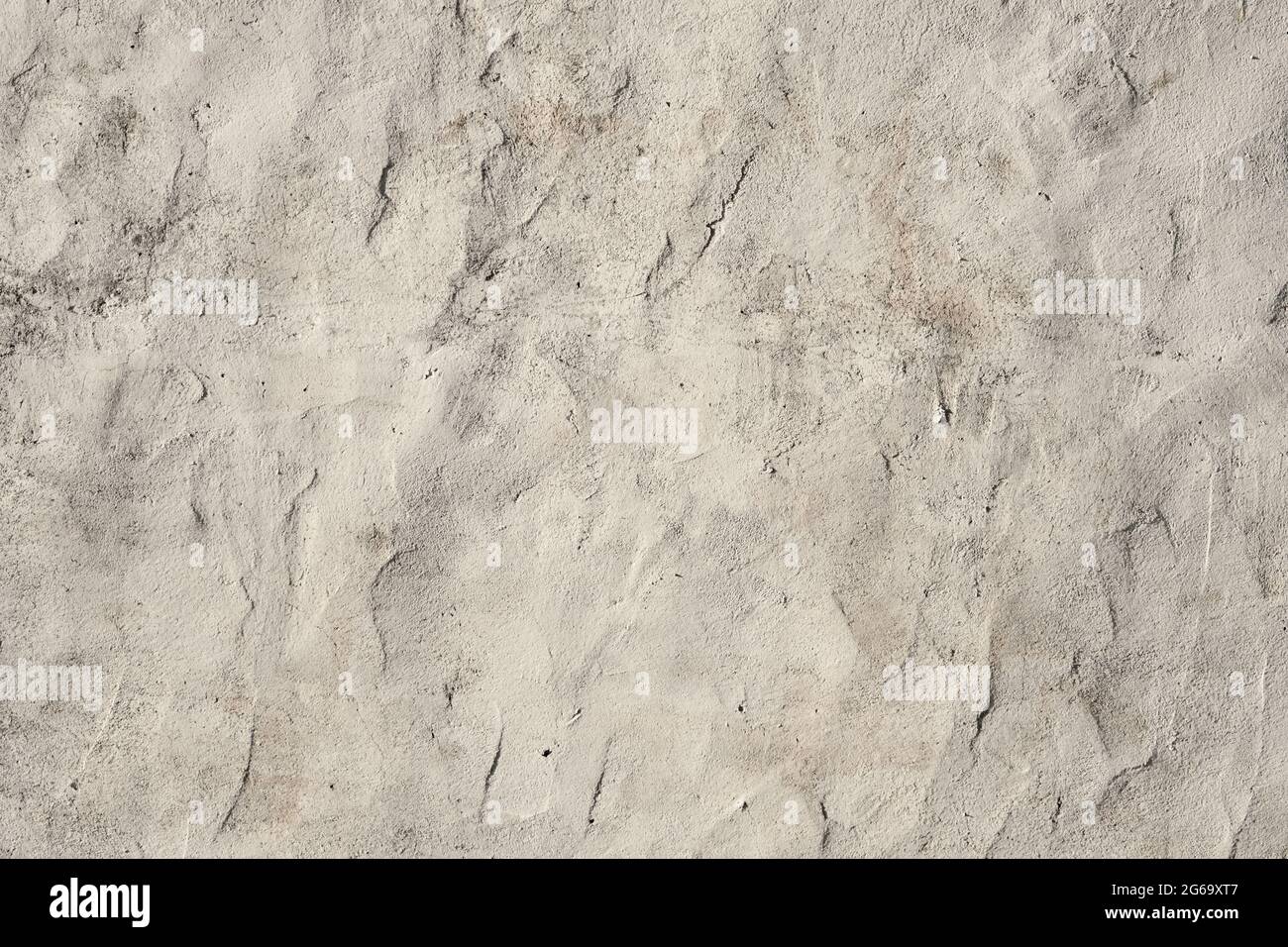 Old white painted limewashed plaster wall texture or background Stock Photo