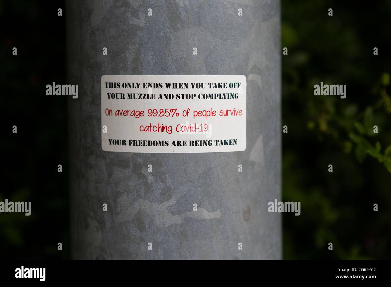Anti Covid, lockdown mask wearing sticker during the Coronavirus pandemic Stock Photo