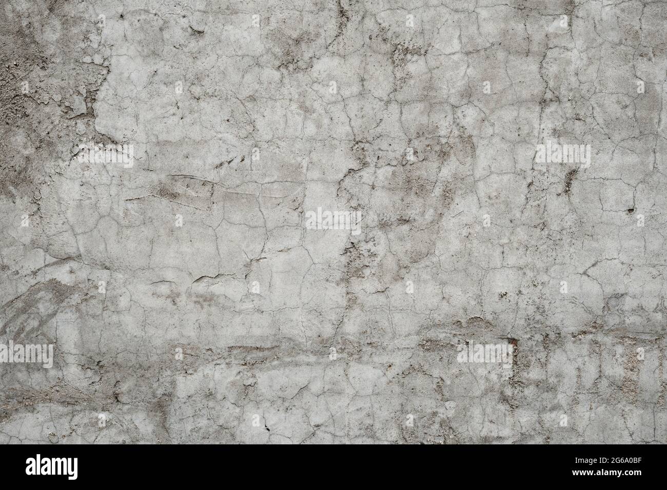 Old cracked raw concrete wall texture grunge background Stock Photo