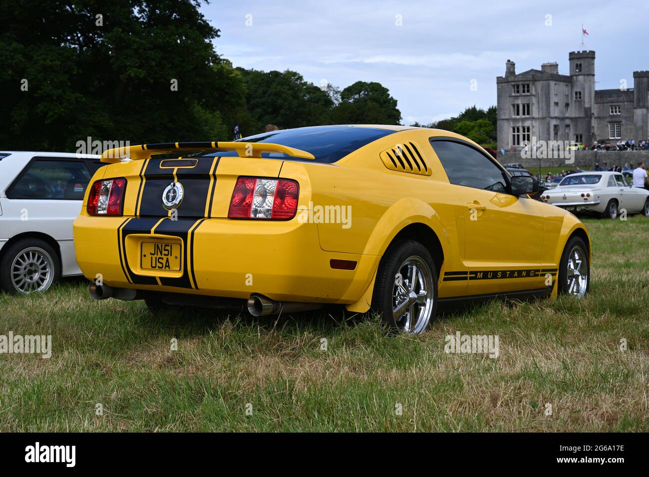 Vintage, yellow Ford Mustang at Leighton Hall Classic Motor Show, July