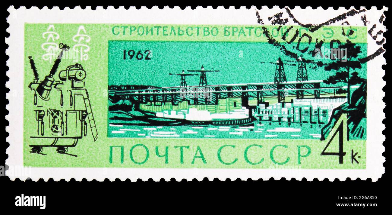 MOSCOW, RUSSIA - APRIL 18, 2020: Postage stamp printed in Soviet Union shows Building of Bratsk Hydro-electric Station, Building of Communism serie, c Stock Photo